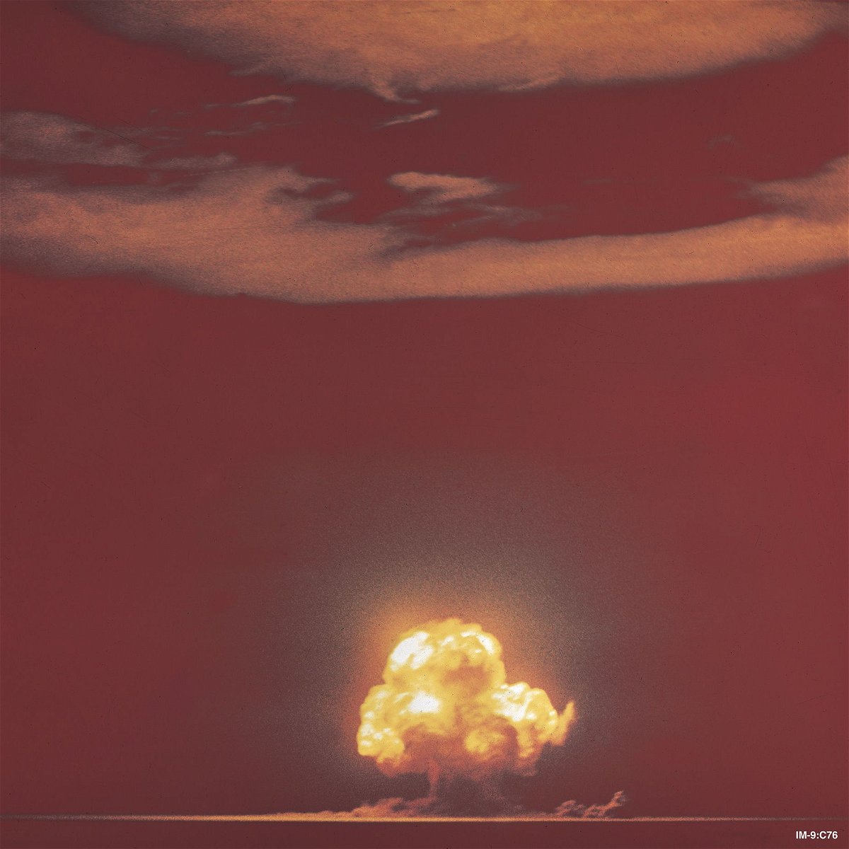 A color photograph of the Trinity mushroom cloud from July 16, 1945 -- and the world would never be the same.