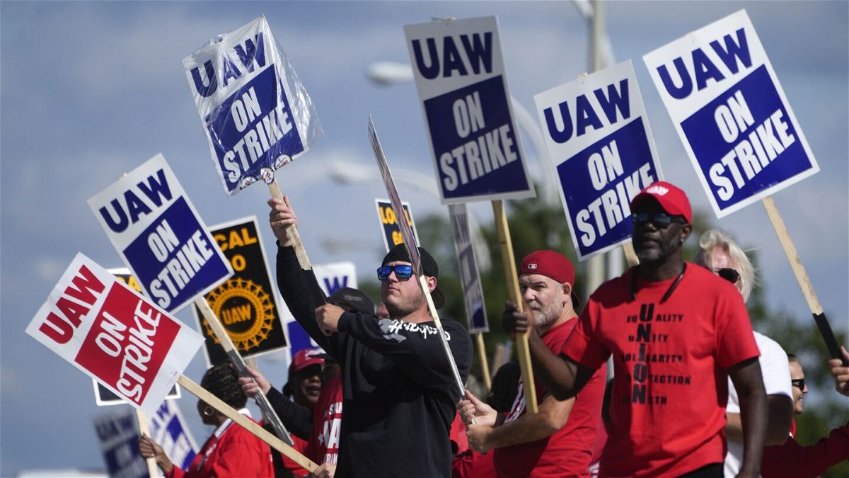 <i>Paul Sancya/AP</i><br/>United Auto Workers members walk the picket line at the Ford Michigan Assembly Plant in Wayne