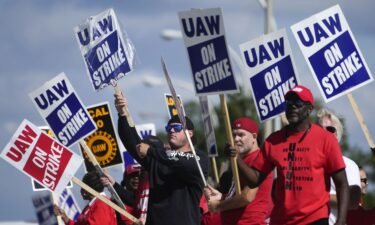 United Auto Workers members walk the picket line at the Ford Michigan Assembly Plant in Wayne