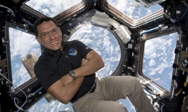 This image provided by NASA shows astronaut Frank Rubio floating inside the cupola