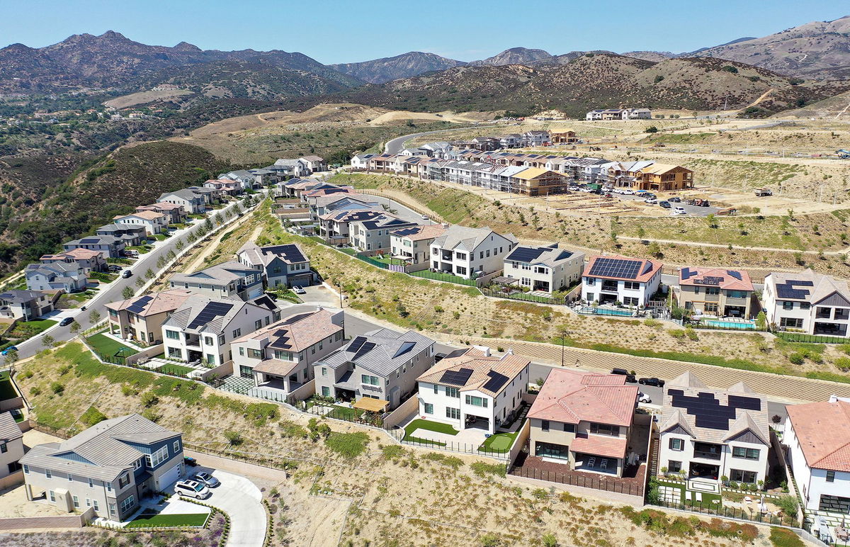 <i>Mario Tama/Getty Images</i><br/>An aerial view of existing homes near new homes under construction (UPPER R) in the Chatsworth neighborhood on September 8 in Los Angeles