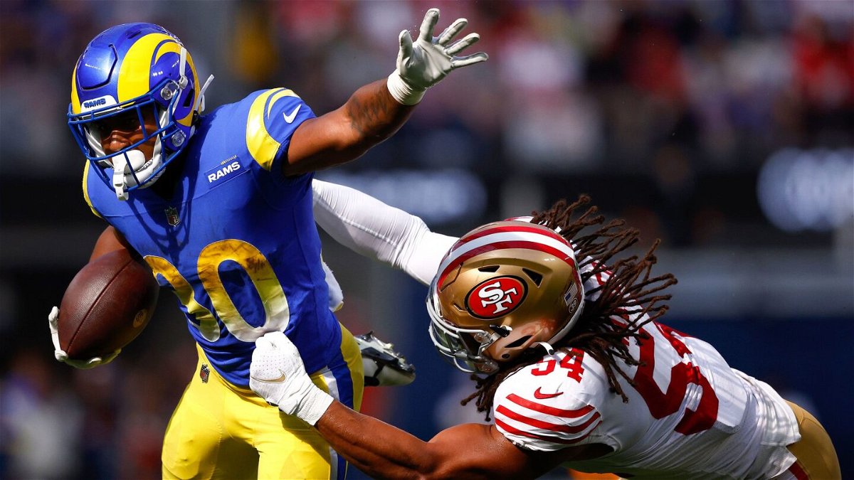 <i>Ronald Martinez/Getty Images</i><br/>Ronnie Rivers #30 of the Los Angeles Rams is tackled by Fred Warner #54 of the San Francisco 49ers during the second quarter at SoFi Stadium on October 30