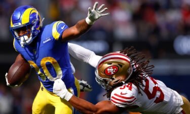 Ronnie Rivers #30 of the Los Angeles Rams is tackled by Fred Warner #54 of the San Francisco 49ers during the second quarter at SoFi Stadium on October 30