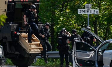 Officers gather as the search for escaped convict Danelo Cavalcante continues on September 12 in Pottstown.