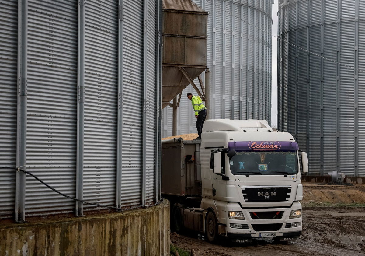 <i>Gleb Garanich/Reuters/FILE</i><br/>A truck with corn is seen at a grain storage facility in the village of Bilohiria