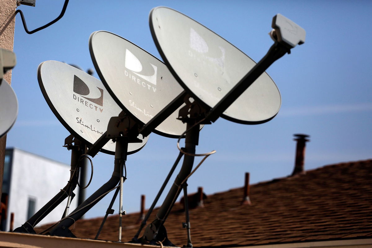 DirecTV satellite dishes are seen on an apartment roof in Los Angeles, California in this file photo taken May 18, 2014.