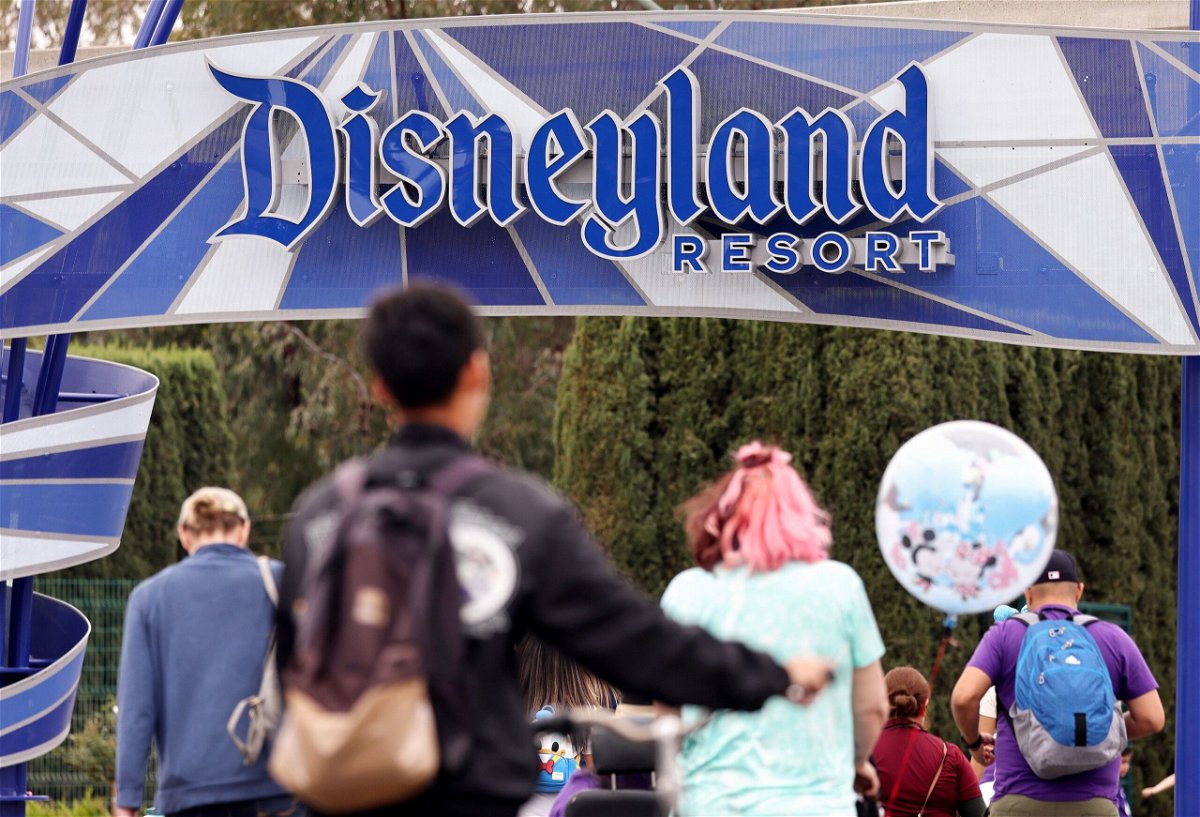 People are seen here entering Disneyland in Anaheim, California, in April. The September 7 settlement will likely translate to a $67.41 check for each of the affected pass-holders, according to the filing.