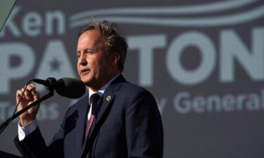 Texas Attorney General Ken Paxton speaks ahead of a rally held by former President Donald Trump