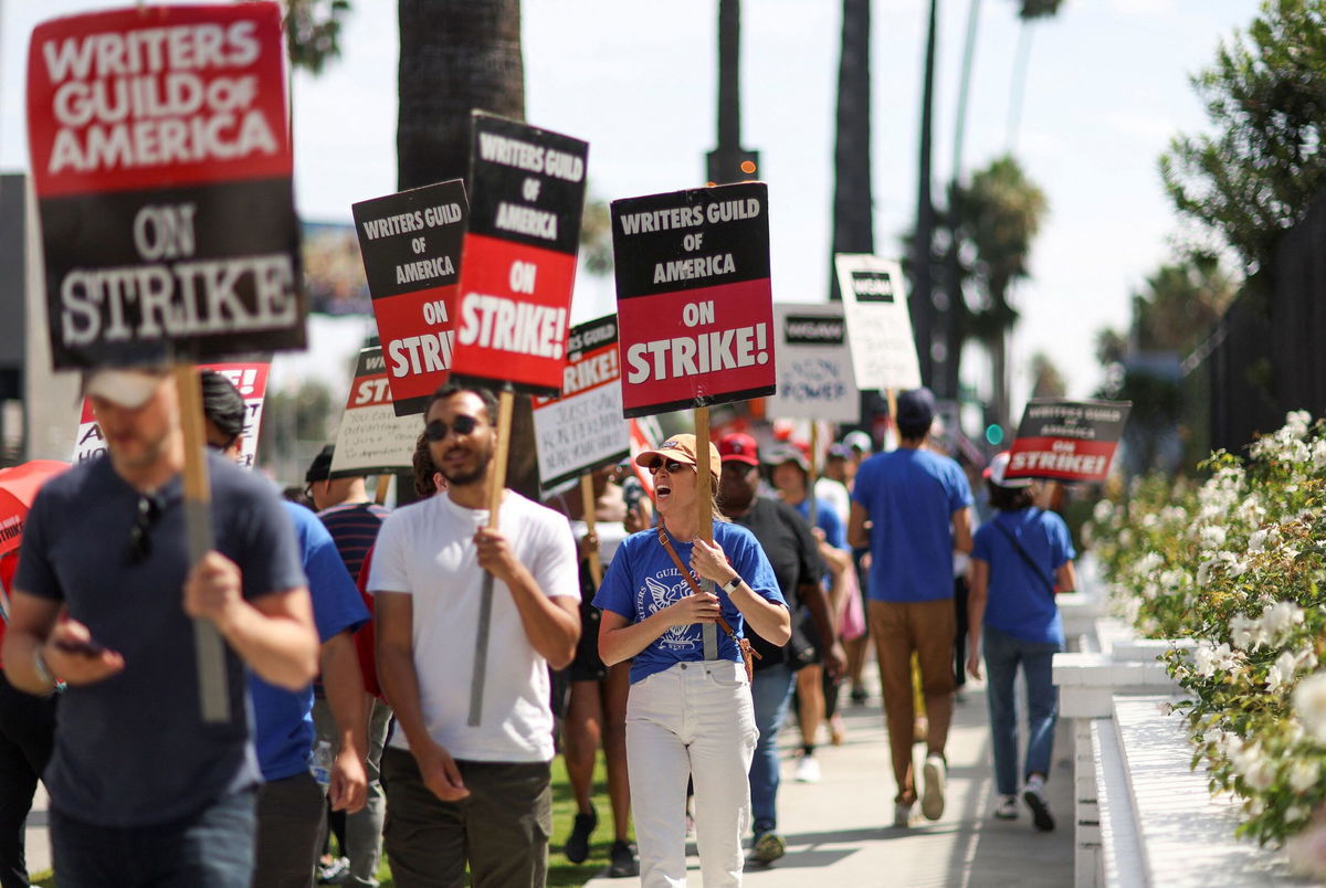 SAG-AFTRA actors and Writers Guild of America writers walk the picket line during their strike outside Netflix offices in Los Angeles earlier this month.