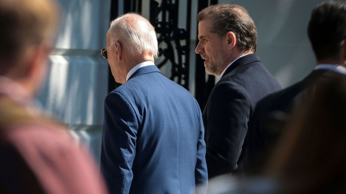 <i>Oliver Contreras/Sipa USA/AP</i><br/>President Joe Biden and his son Hunter Biden walk on the South Lawn of the White House during the annual Easter Egg Roll on the South Lawn in Washington