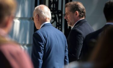 President Joe Biden and his son Hunter Biden walk on the South Lawn of the White House during the annual Easter Egg Roll on the South Lawn in Washington