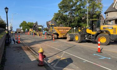 Firefighters pull a construction worker from a fallen trench box on Retreat Avenue in Hartford