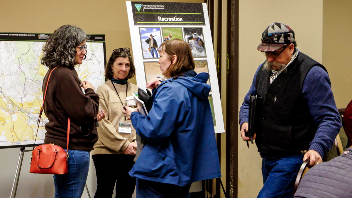 BLM Idaho State Director Karen Kelleher talks with the public at a renewable energy meeting.