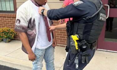 An officer with the Pitcairn Police Department stepped in to help a teen with his tie for his first school dance.