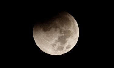 The full beaver moon begins to pass through the Earth's shadow during a total lunar eclipse in November in New York. On Saturday