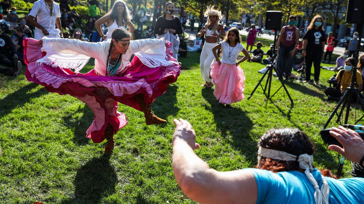 Chali'Naru Dones, with the United Confederation of Taino People, dances during an Indigenous Peoples' Day rally and march in Boston on October 10, 2020.