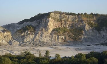 Solfatara is a shallow volcanic crater at Pozzuoli