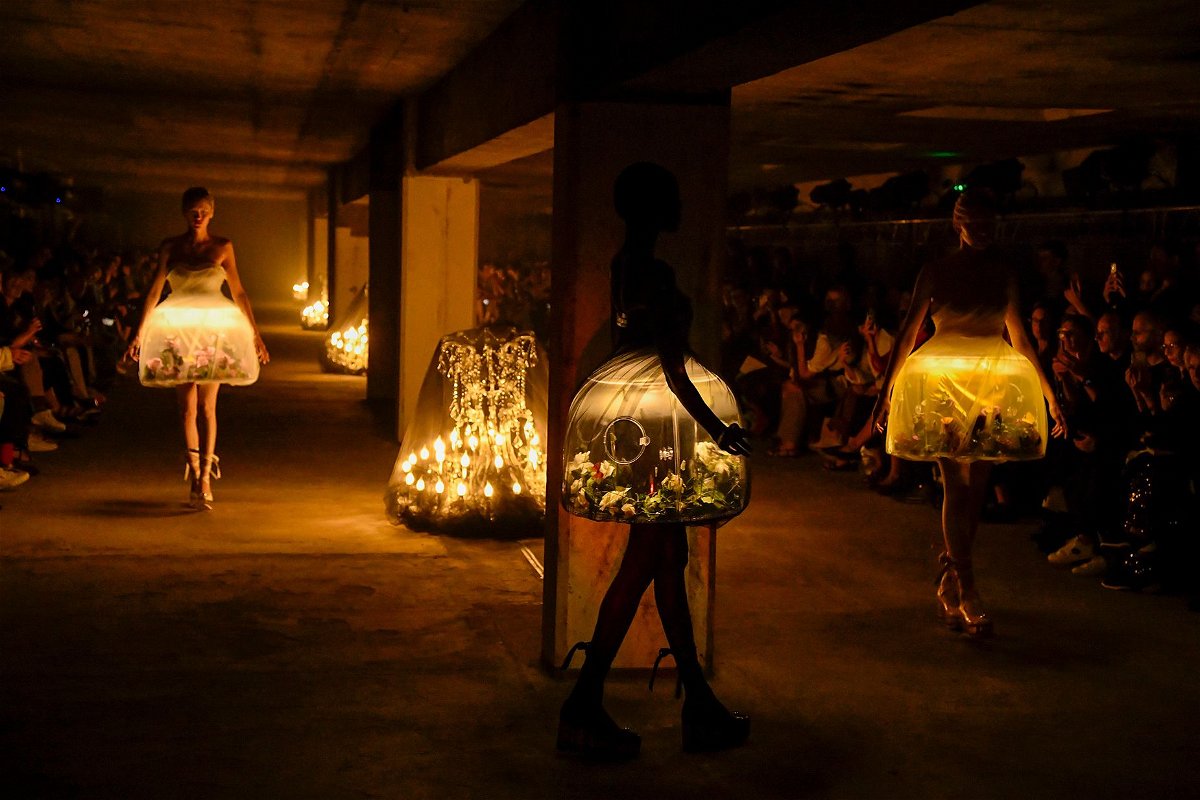 <i>Victor Virgile/Gamma-Rapho/Getty Images</i><br/>Eerily romantic terrarium dresses featuring live butterflies at the Undercover show —  a standout moment of fashion innovation.