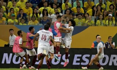Venezuela's players celebrate Bello's goal.