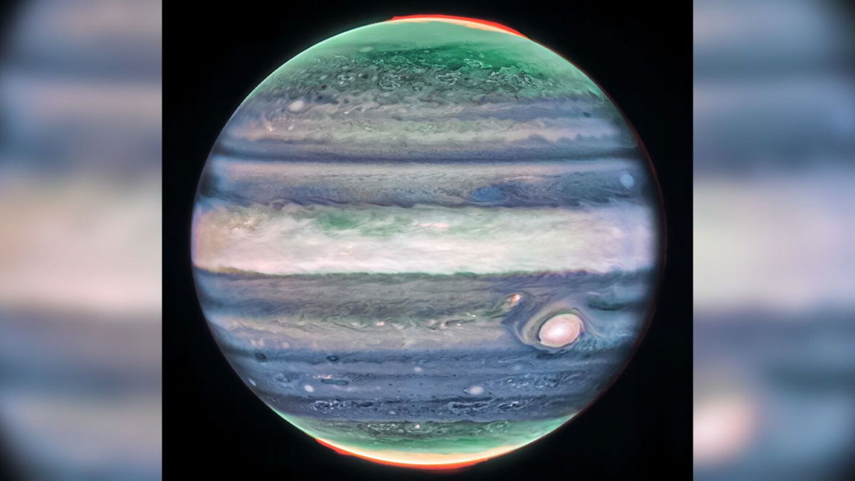 The James Webb Space Telescope’s Near-Infrared Camera captured an image of Jupiter in infrared light and the bright white spots and streaks are likely high-altitude cloud tops of storms.