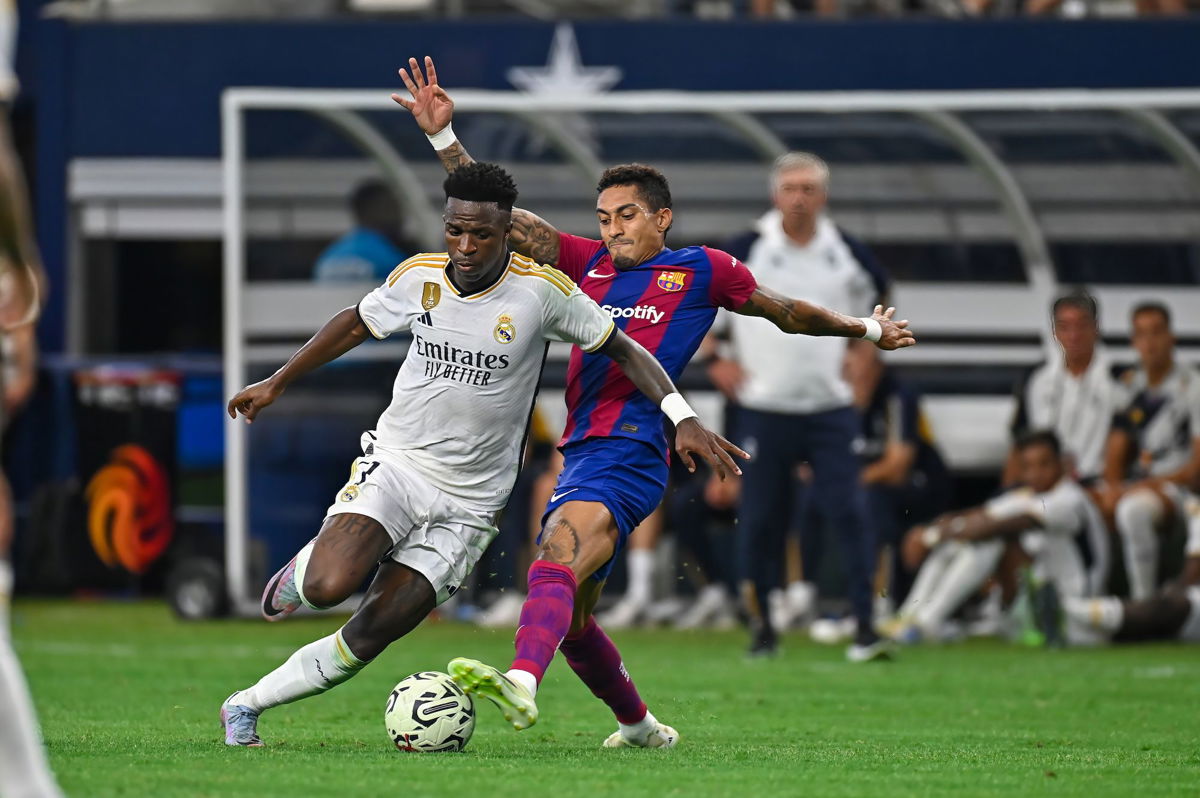 <i>Kevin Langley/Icon Sportswire/Getty Images</i><br/>Vinícius vies with Barcelona forward Raphinha for possession during a match in Arlington
