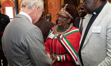 Charles shaking hands with Kenyan president Jomo Kenyatta at his country home at Gatundi