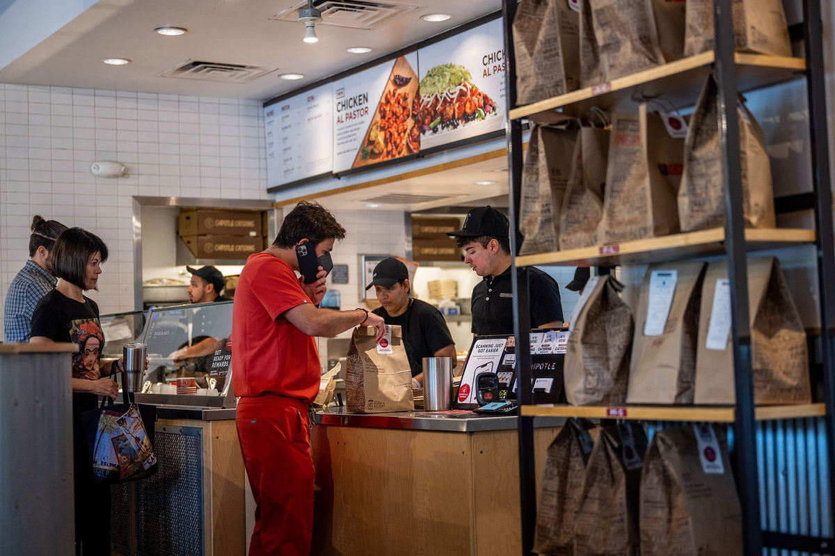 Customers order food at a Chipotle Mexican Grill restaurant on April 26 in Austin, Texas.