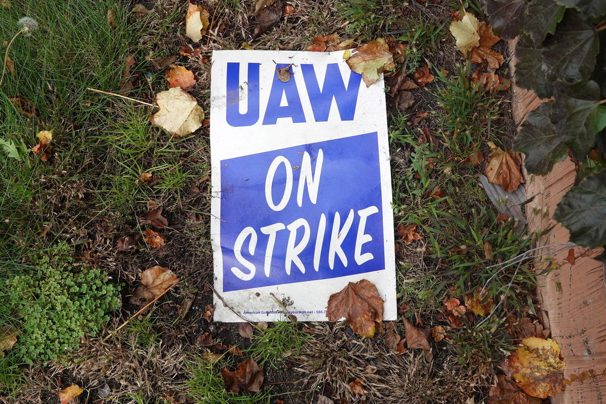 A strike sign lays in the grass outside of Ford's Chicago Assembly Plant on October 26, in Chicago, Illinois.