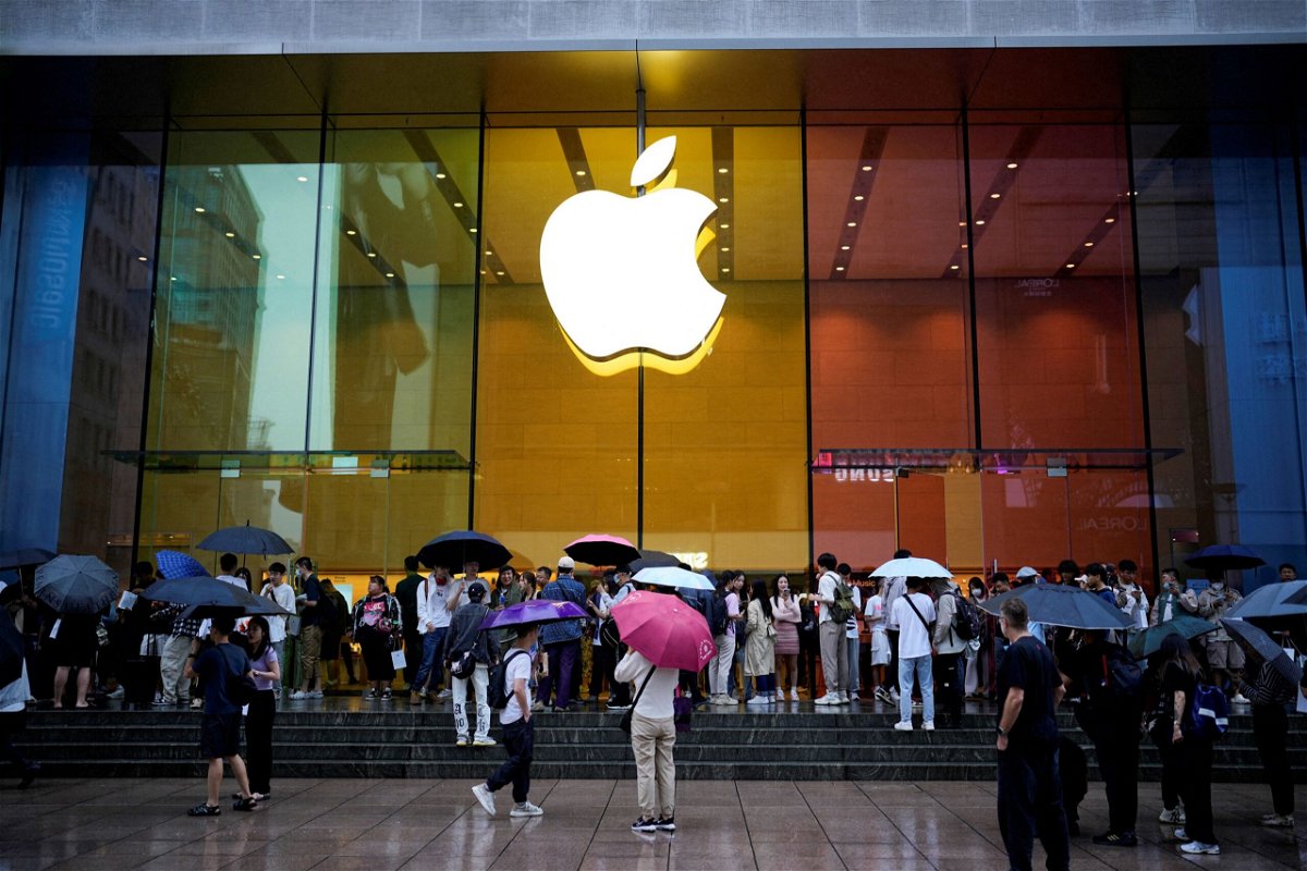 People stand outside an Apple Store as Apple's new iPhone 15 officially goes on sale across China, in Shanghai, China September 22.