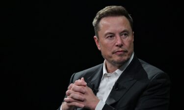 Elon Musk looks on as he speaks during his visit at the Vivatech technology startups and innovation fair at the Porte de Versailles exhibition center in Paris