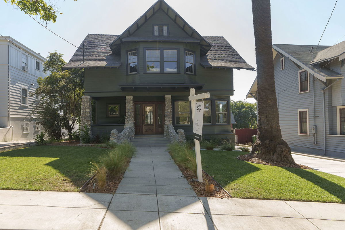 Mortgage rates are nearing 8%. Prices have climbed for the past three months straight, and seen here, a for sale sign is posted outside a home in the Angelino Heights historical neighborhood of Los Angeles, on Oct. 19.