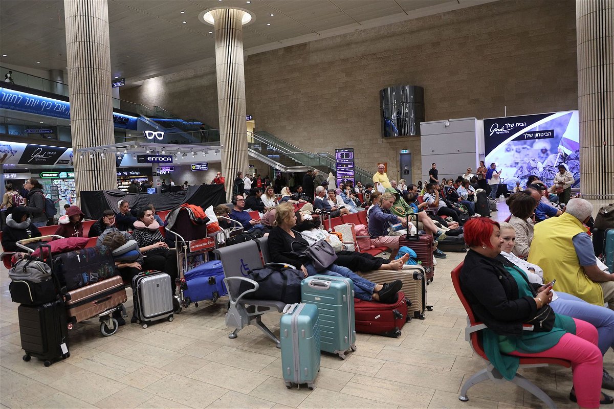 <i>Gil Cohen-Magen/AFP/Getty Images</i><br/>Passengers wait at Ben Gurion Airport near Tel Aviv