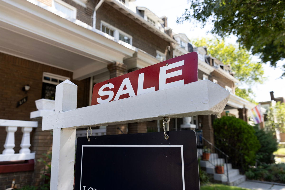 A sign advertises a home for sale in Washington, DC, on August 23. The average US mortgage rate hit 7.49% this week, the highest level in 23 years.