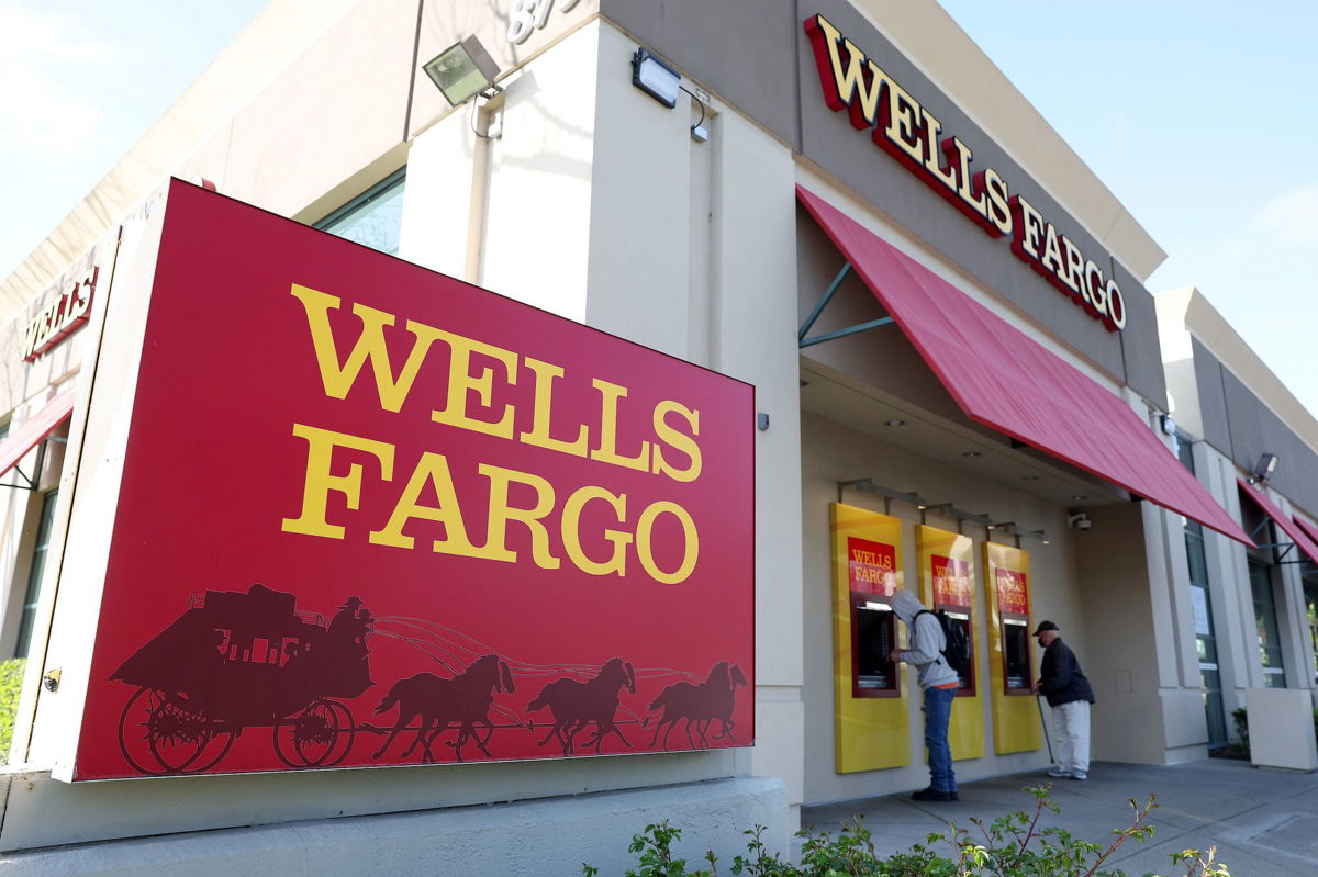 <i>Justin Sullivan/Getty Images</i><br/>Customers use ATMs at a Wells Fargo Bank on April 14 in San Bruno