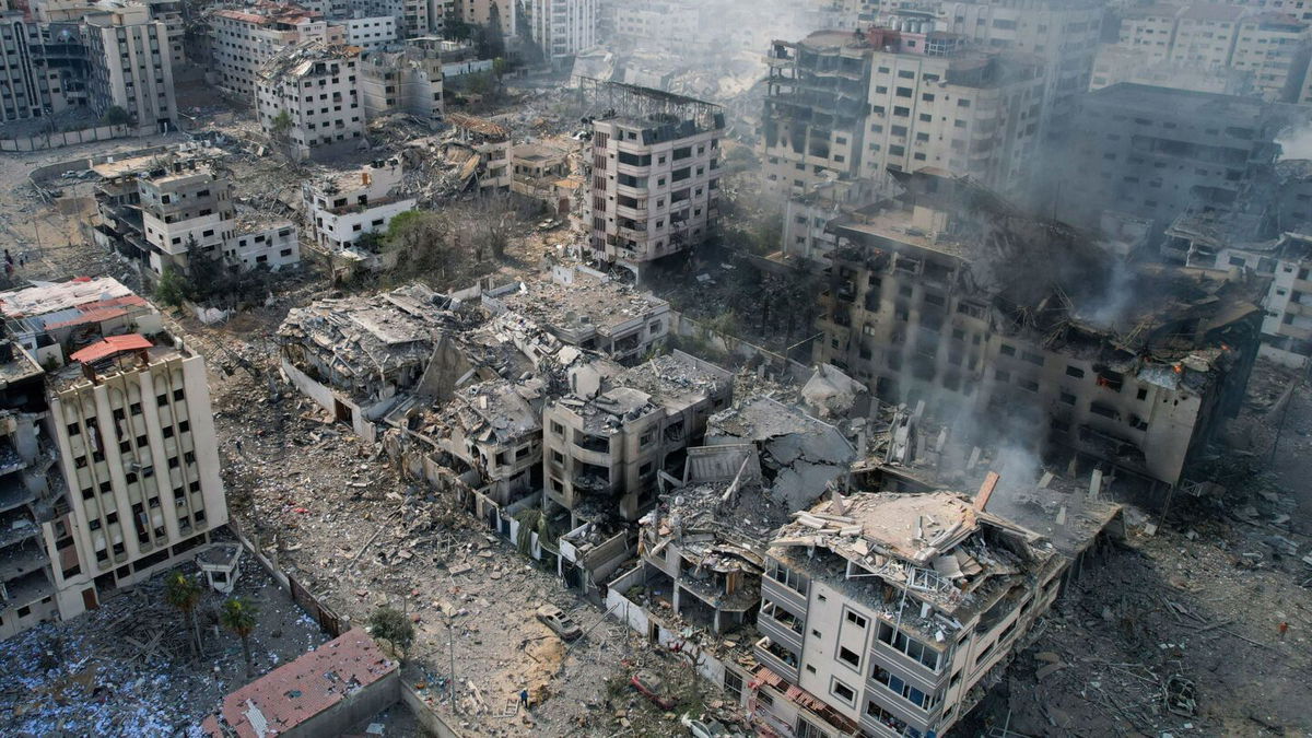 <i>Belal Al Sabbagh/AFP via Getty Images</i><br/>This aerial photo shows heavily damaged buildings following Israeli airstrikes in Gaza City on October 10. Israel is gearing up for the next stage of its war on Hamas.