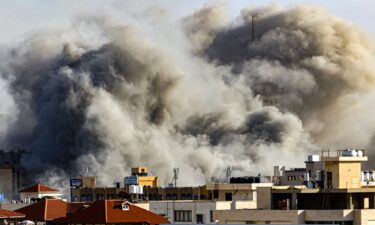 Smoke plumes rise over Gaza City on October 7 during Israeli air strikes. Palestinian militants have begun a "war" against Israel