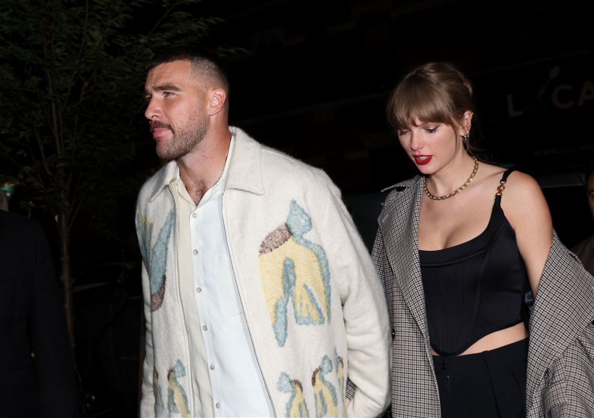 Travis Kelce and Taylor Swift hold hands in New York City on October 14.