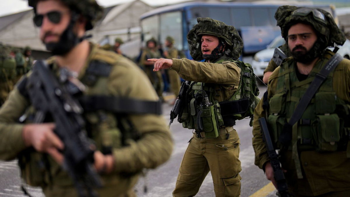 <i>Jalaa Marey/AFP via Getty Images</i><br/>Israeli soldiers take a position in the northern town of Kiryat Shmona close to the border with Lebanon on October 16. Israel's army said on Monday it was evacuating residents living along its northern border with Lebanon amid rising tensions there.