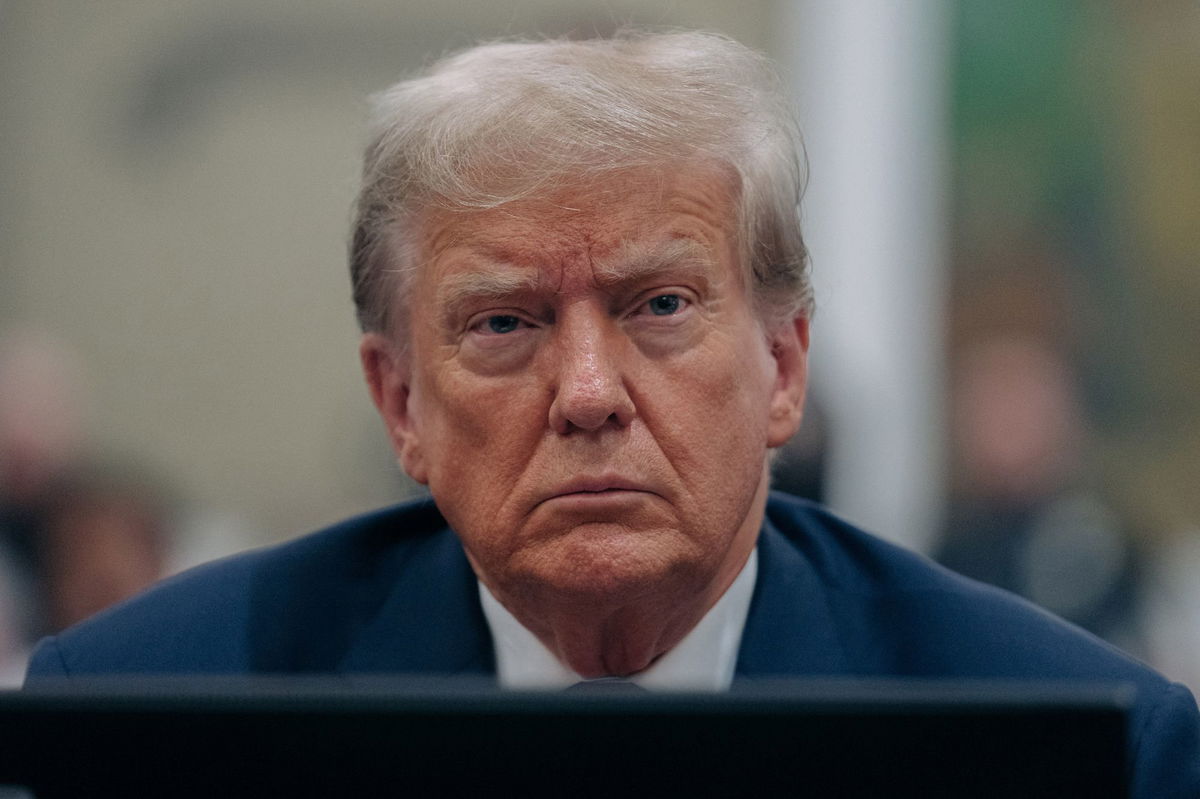 <i>Jeenah Moon/Pool/Reuters</i><br/>Former President Donald Trump listens during his civil fraud trial at the State Supreme Court building in New York on October 4.