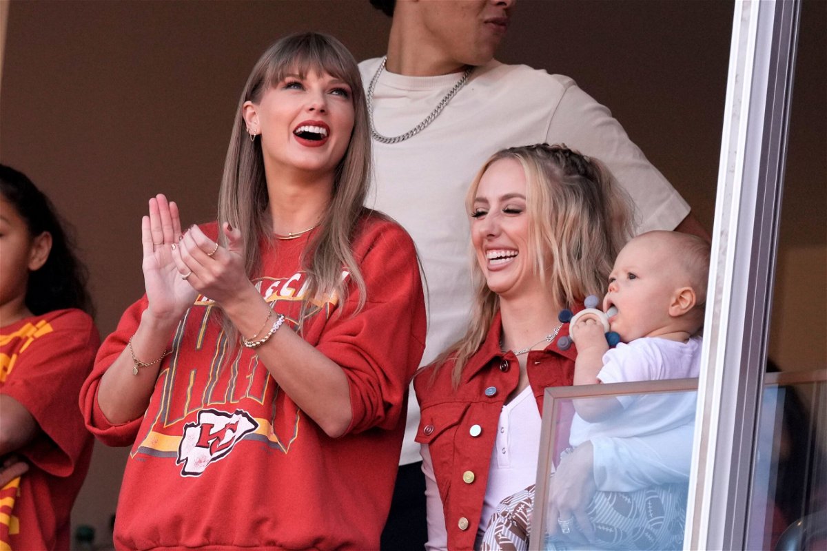 Taylor Swift cheers alongside Brittany Mahomes, right, before the start of an NFL football game between the Kansas City Chiefs and the Los Angeles Chargers on October 22 in Kansas City, Missouri.