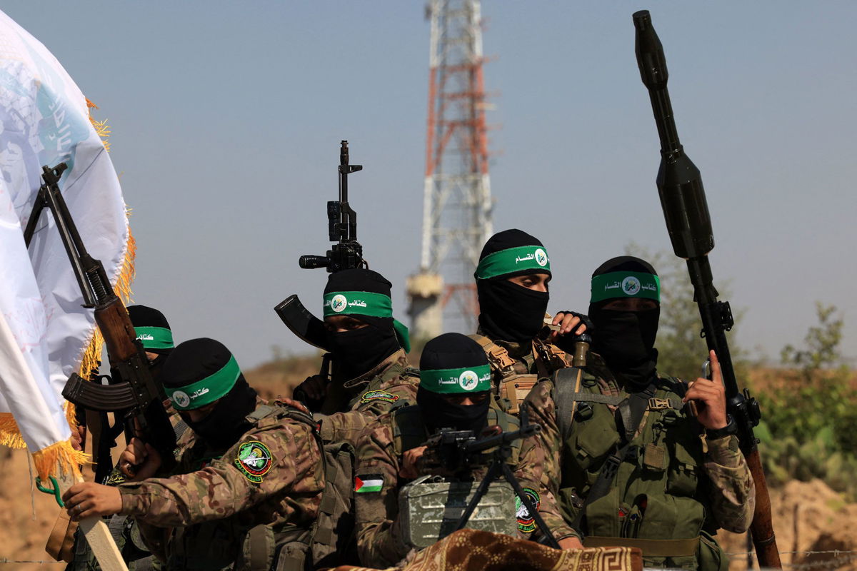 <i>Mahmud Hams/AFP/Getty Images</i><br/>Palestinian fighters of the al-Qassam Brigades