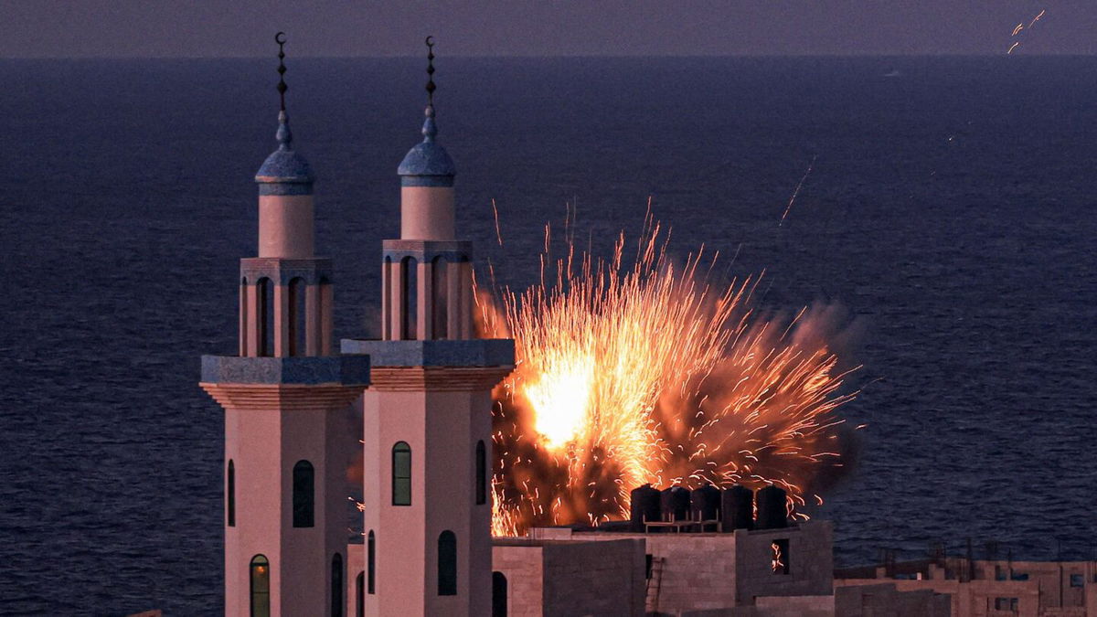 <i>Mahmud Hams/AFP/Getty Images</i><br/>A fireball erupts from an Israeli airstrike in Gaza City on October 12