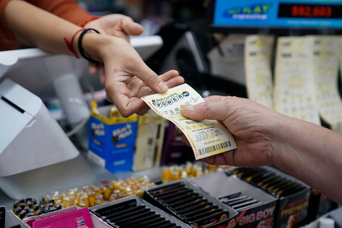 A lottery player purchases a ticket in Pineville, North Carolina, on October 4.