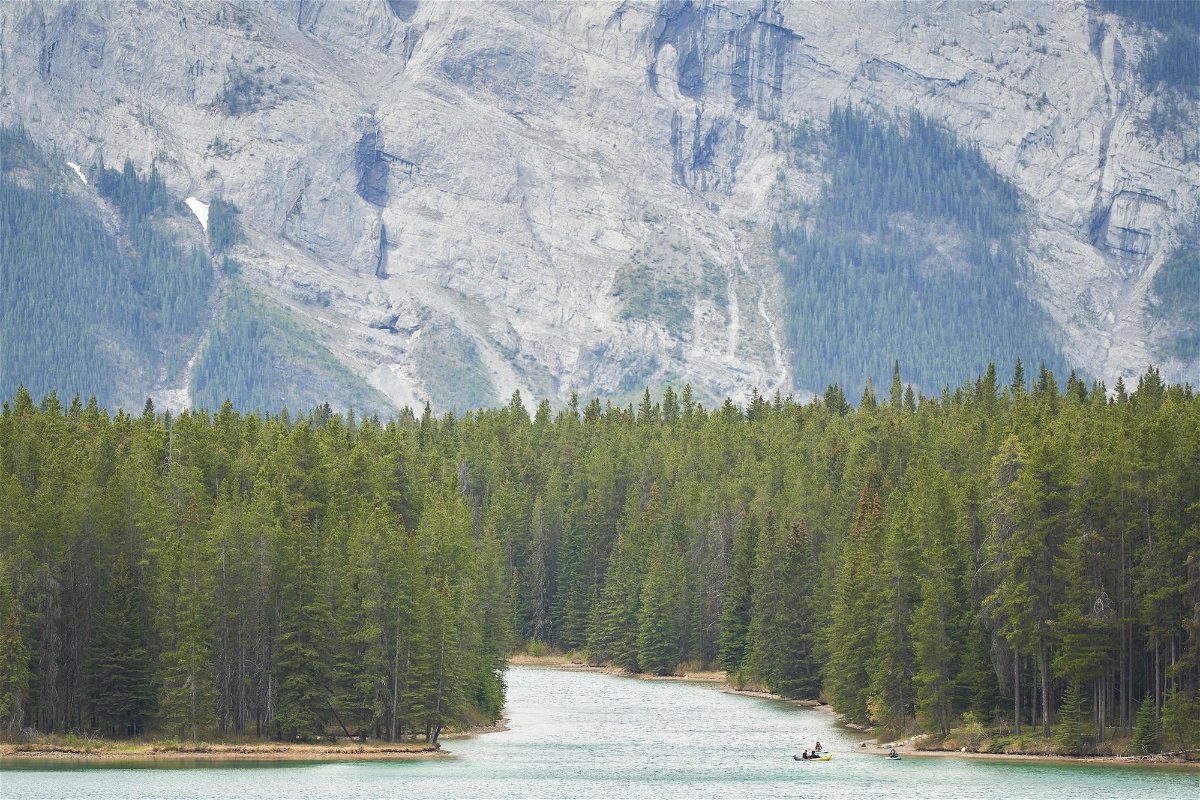 <i>Geoff Robins/AFP/Getty Images</i><br/>Two people are dead after a suspected grizzly bear attack in Canada’s Banff National Park. Pictured is Lake Minnewanka in Banff National Park in Alberta