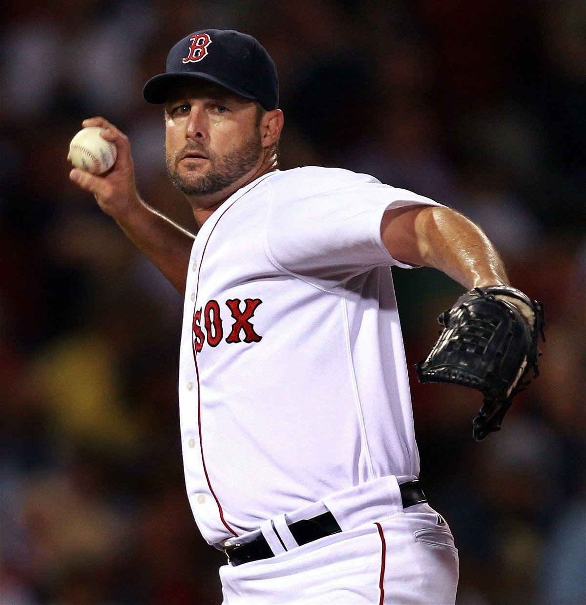 <i>Yoon S. Byun/The Boston Globe/Getty Images</i><br/>Red Sox pitcher Tim Wakefield waves to the crowd after winning his 200th (and final) career win in September 2011.