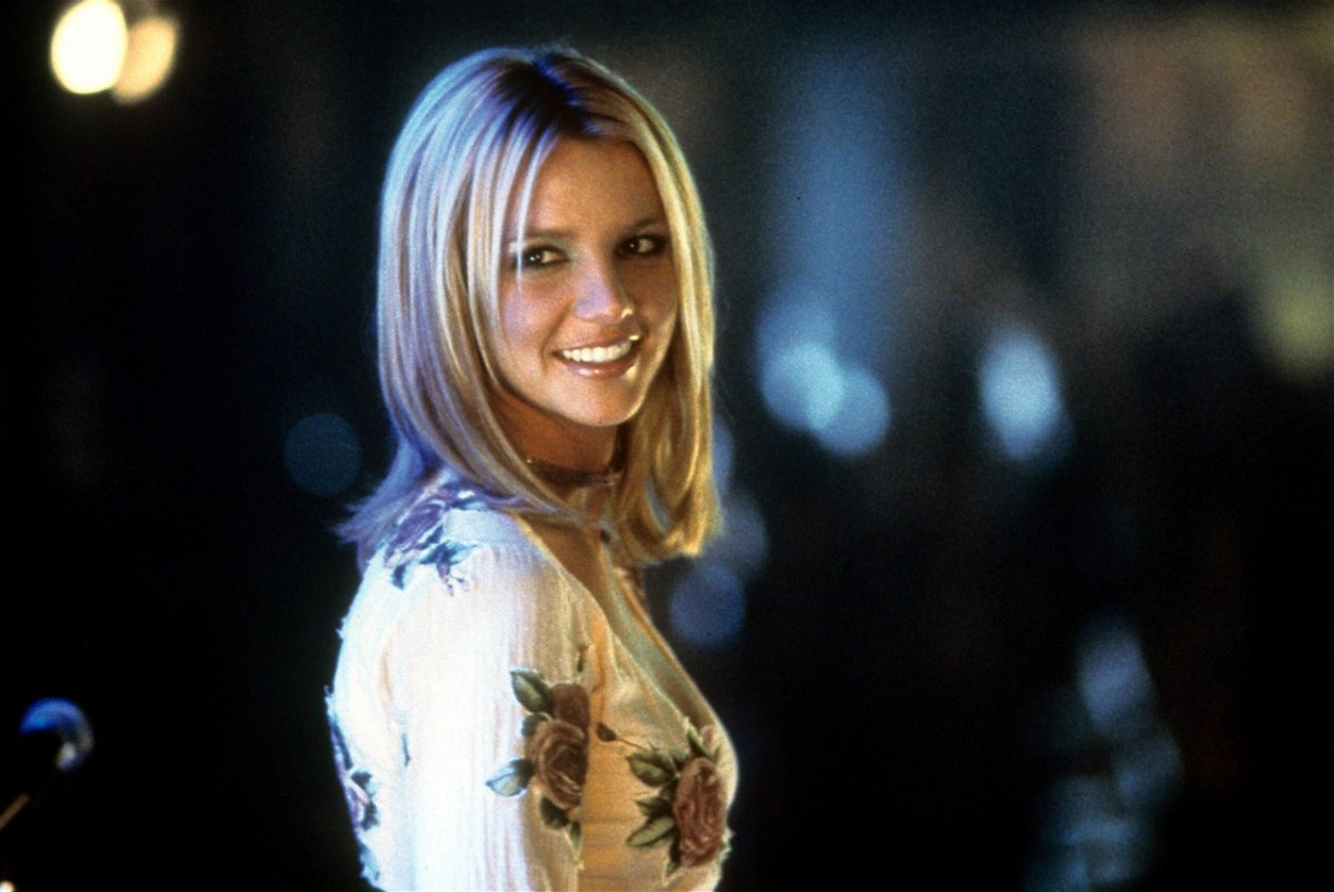 <i>Paramount/Moviepix/Getty Images</i><br/>Britney Spears smiling as she looks back in a scene from the 2002 film 