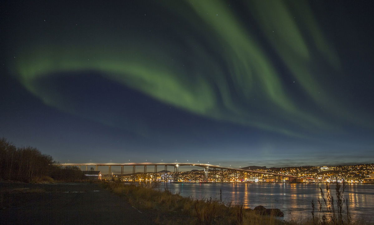 The northern lights shine over Tromso in October 2014.