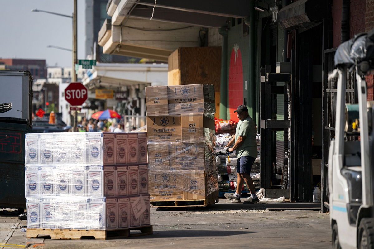 A worker wheels a pallet at a wholesale produce market in the Union Market district in Washington, DC, on Sept. 8.