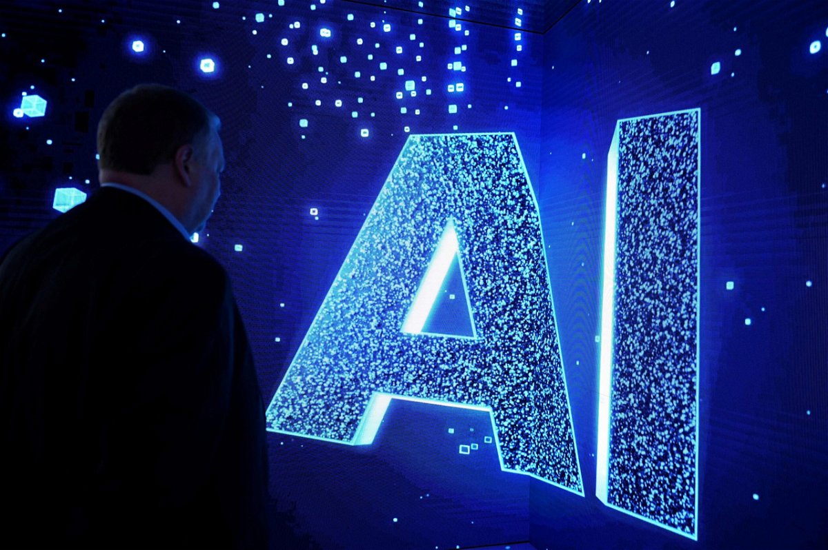 <i>Josep Lago/AFP/Getty Images</i><br/>Collins Dictionary has named “AI” its word of the year. In this image
