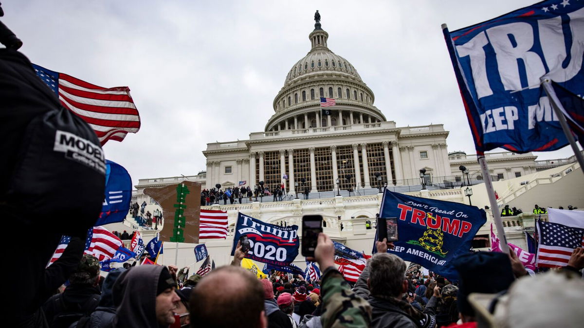 <i>Samuel Corum/Getty Images</i><br/>Pro-Trump supporters storm the U.S. Capitol following a rally with President Donald Trump on January 6